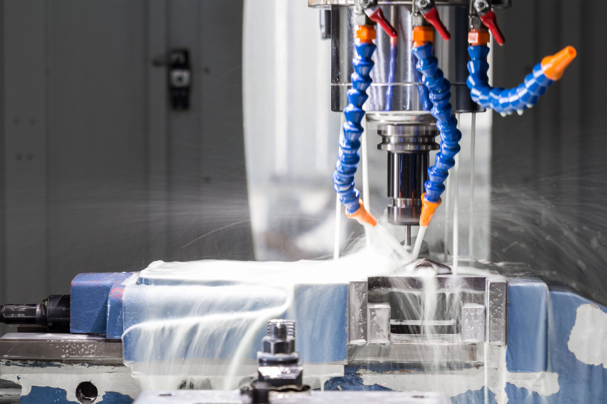 Coolant being applied to metal components during machining