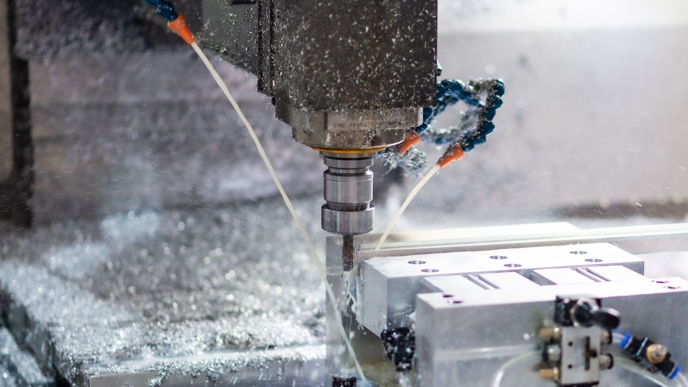 Coolant being applied to metal components during machining
